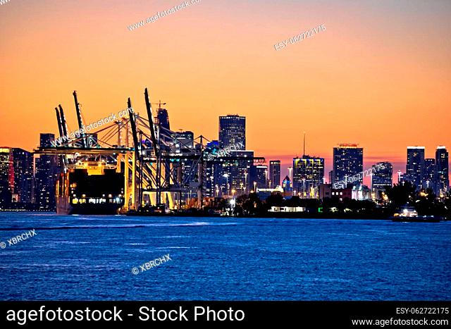 Port of Miami docks and cranes dusk view, Florida state, USA