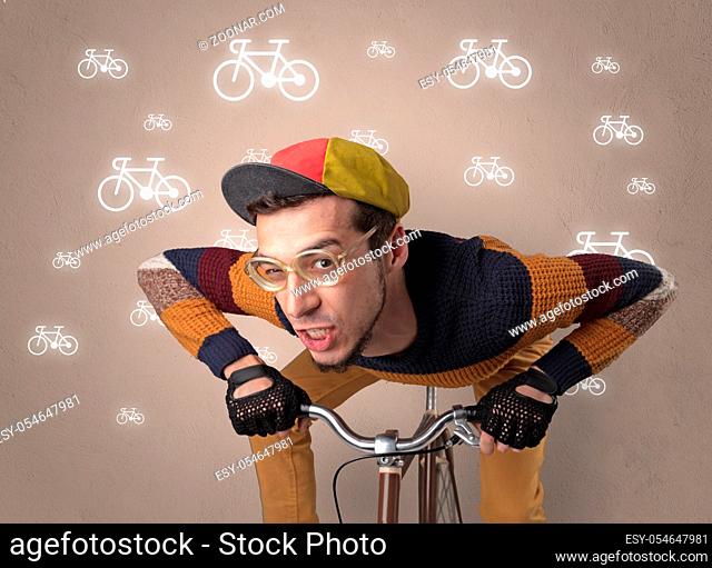 Young ridiculous biker with line drawn bikes on the background