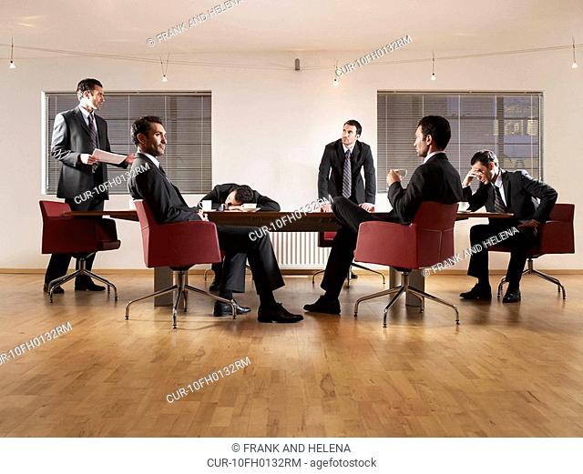 Business man at boardroom table. Photo montage with same person in different positions, sleeping, listening, drinking coffee