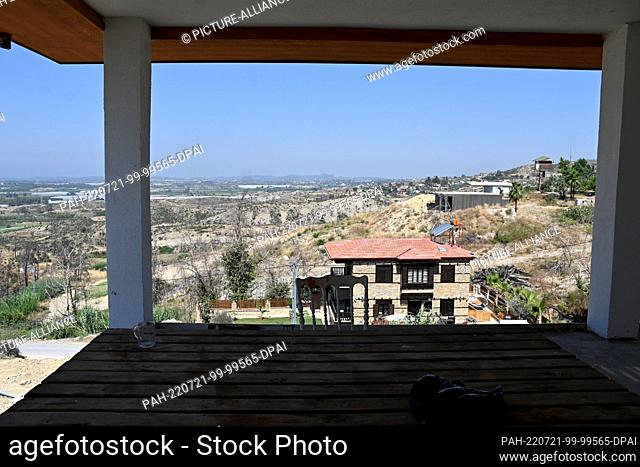 19 July 2022, Turkey, Kalemler/Manavgat: View from the shell of the house of the Rautert family, who lost their home after the forest fires of 2021