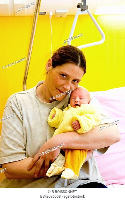 Photo essay from hospital. Mother-child center. Hospital of Meaux 77, France. Mother and her 2-day-old newborn baby girl