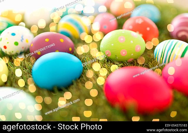 colored easter eggs on artificial grass