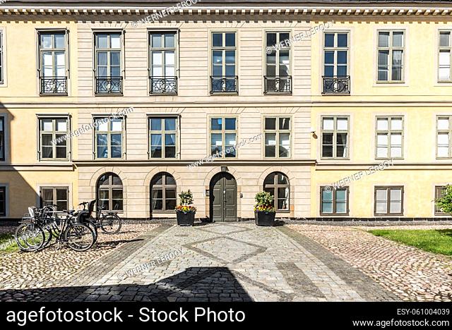 Stockholm, Sweden - 07 24 2019- Bicycles standing at the facade of a neo classical building in Stockholm