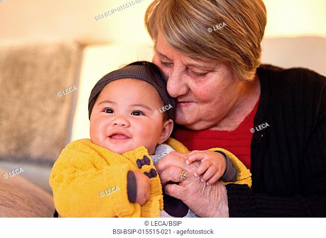 6-month old baby with her adoptive grandmother