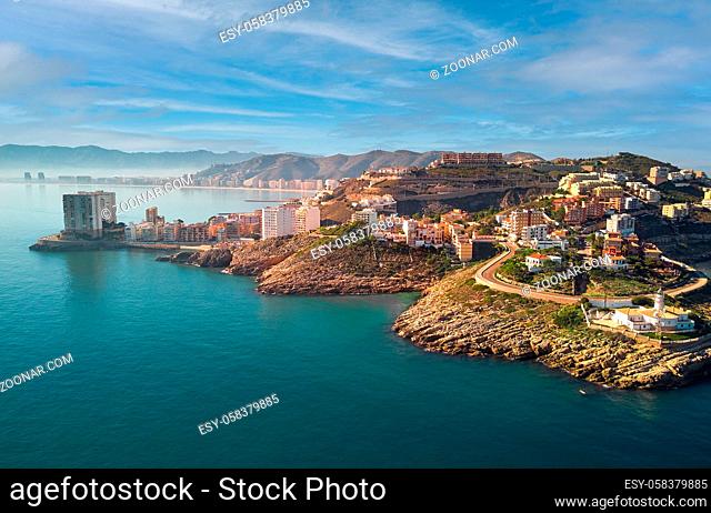 Aerial drone point of view Cullera townscape rooftops during sunny winter day. Touristic famous place. Province of Alicante, Costa Blanca, Spain
