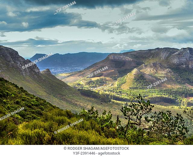 View down Orange Kloof, a protected indigenous nature reserve on the back slopes of Table Mountain, to Constantia Nek, Cape Town, South Africa