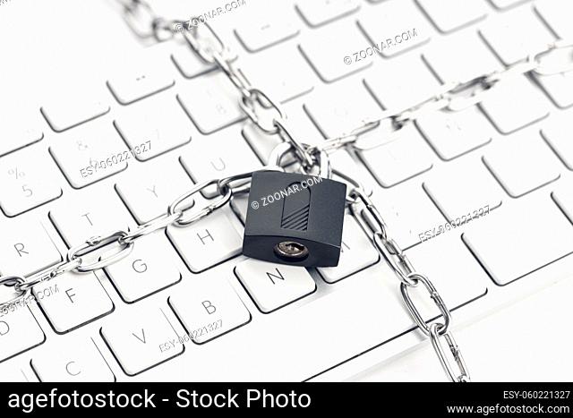 Computer Security concept. Chain and padlock on keyboard. Cyber security concept
