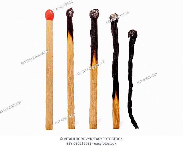 Closeup of several burnt matches isolated on white background