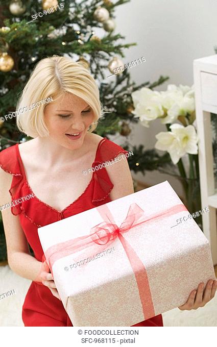 Woman holding Christmas parcel