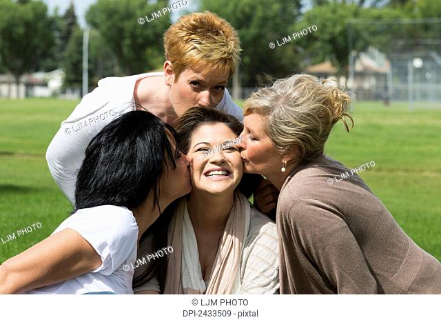 Bride-to-be spending quality time with her mother, stepmother and mother-in-law; Edmonton, Alberta, Canada