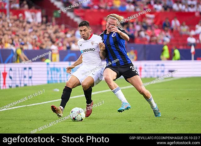 Seville, Spain. 25th October 2022. Gonzalo Montiel (2) of Sevilla FC and Victor Kristiansen (34) of FC Copenhagen seen during the UEFA Champions League match...