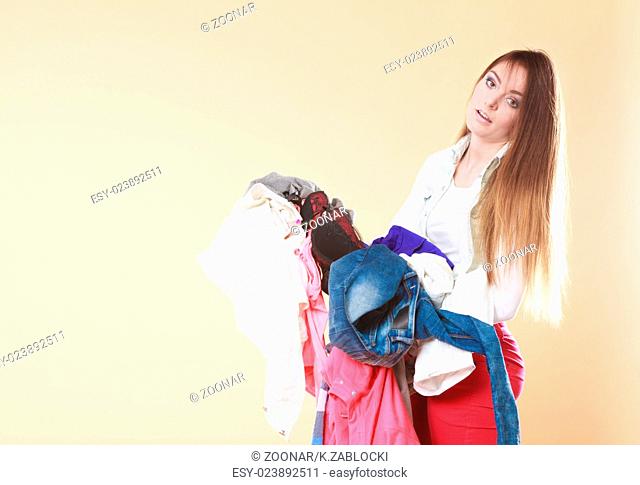 Woman carrying dirty laundry clothes