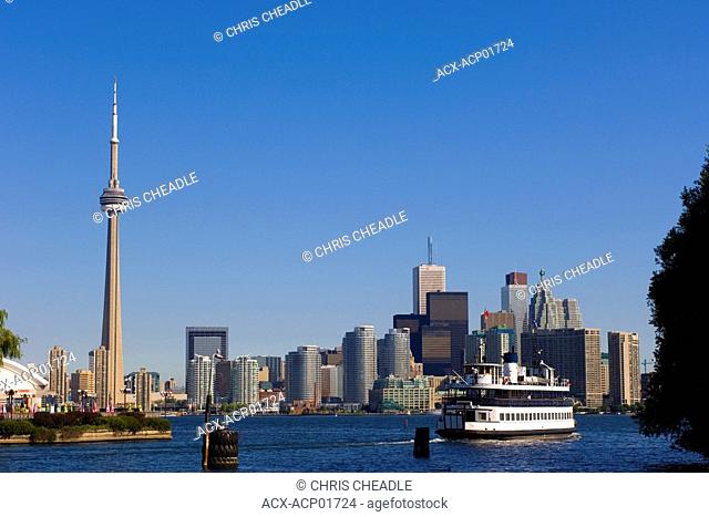 Skyline view and Ferry from across Lake Ontario from Toronto Islands of Toronto, Ontario, Canada