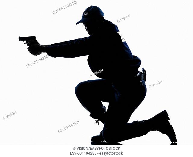 Side view of a silhouetted Afro American police officer aiming gun isolated on white background