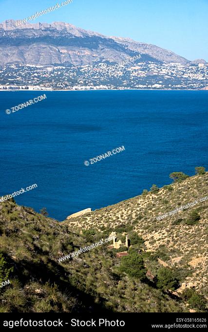 Natural park 'Serry Gelada' with view to Altea and ruin of ocher mine along the coast of Albir, Costa Blanca, Spain