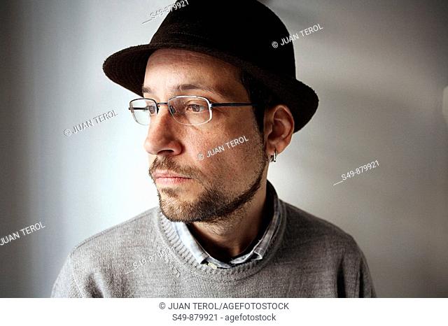 Man wearing glasses and hat