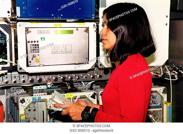06/11/2001 -- During Crew Equipment Interface Test CEITactivities at SPACEHAB, Cape Canaveral, Fla., STS-107 Mission Specialist Kalpana Chawla looks over...