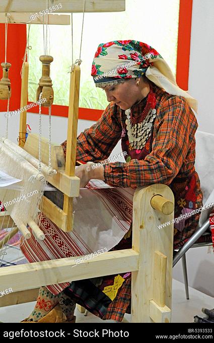 Caucasian woman weaving, weaver, handwork, loom