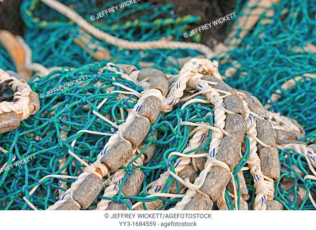 Pacific herring purse seine net and lead line on stack on fishing boat in Sitka, Alaska