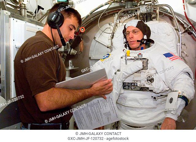 Astronaut Clayton C. Anderson, Expedition 15 flight engineer, participates in an Extravehicular Mobility Unit (EMU) spacesuit fit check in the Space Station...