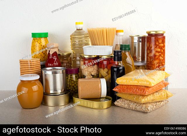 Emergency survival food set on white kitchen table