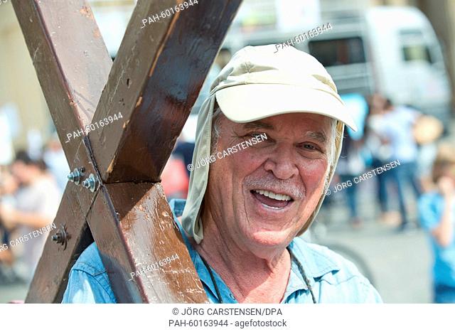 US itinerant preacher Arthur Blessitt stands in front of the Brandenburg Gate in Berlin, Germany, 17 July 2015. Blessitt always carries an approximately 3