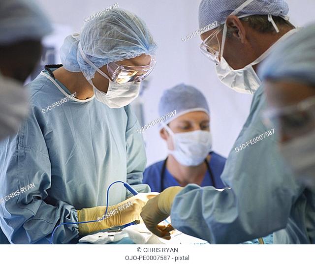 Team of nurses and surgeons in surgery
