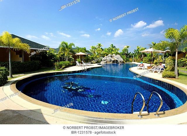 Divers training, tourists on sun chairs at pool, bungalows with green surroundings, Palm Garden Resort, Khao Lak, Phuket, Thailand, Asia
