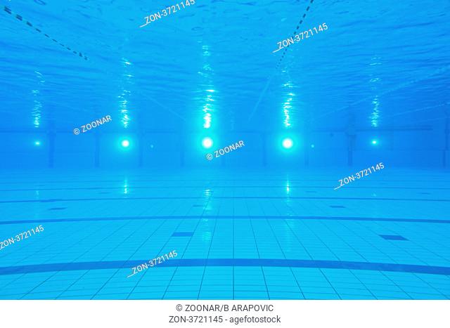 sport swimming pool underwater with blue color and swimmers