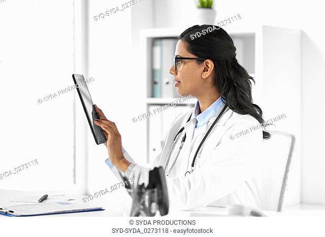 female doctor with tablet computer at hospital
