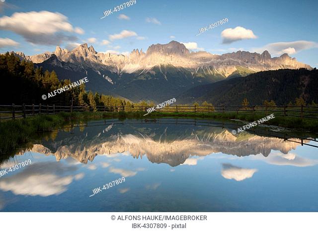Rosengarten, evening light, reflection in lake, Dolomites, South Tyrol, Italy