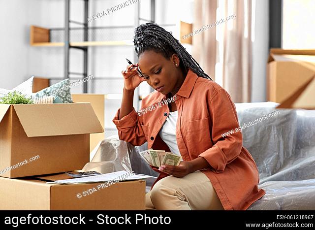 woman moving to new home and counting money