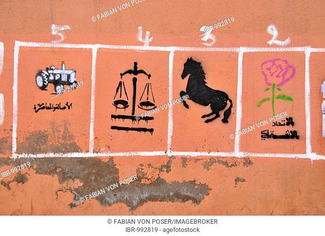 Moroccan vote advertising with the symbols of the various parties on a wall, Marrekech, Morocco, Africa