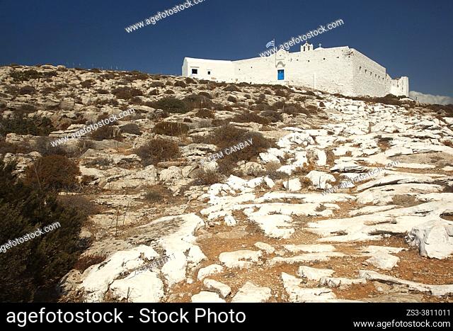 View to the Zoodohos Pigi Monastery on the top of the hill at the upper side of the Kastro or Castle village , Sikinos Island, Cyclades Islands, Greek Islands