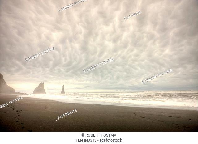 Storm clouds over the ocean and sea stacks near Vik, southern Iceland