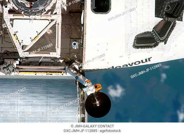 This high angle, partial view of the starboard side of the space shuttle Endeavour's crew cabin and forward payload bay was provided by an Expedition 27 crew...