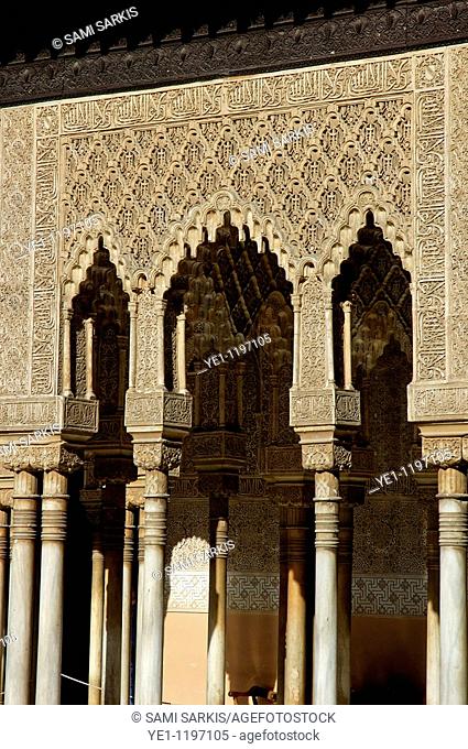 Ornate exterior of the Patio de los Leones area at Alhambra, a 14th-century palace in Granada, Andalusia, Spain