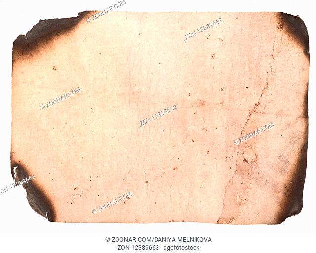 Old paper with burned edges on white background