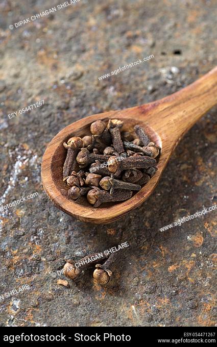 Cloves on a textured background. Spices, Food and cuisine ingredients