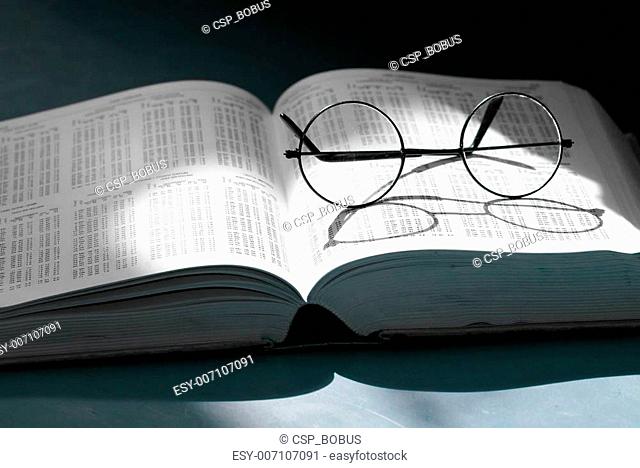 glasses in a book