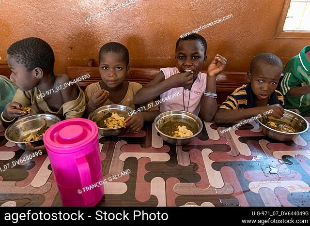 Orphanage run by Vivre dans l'Esperance (living with hope) NGO in Dapaong, Togo. Children having lunch