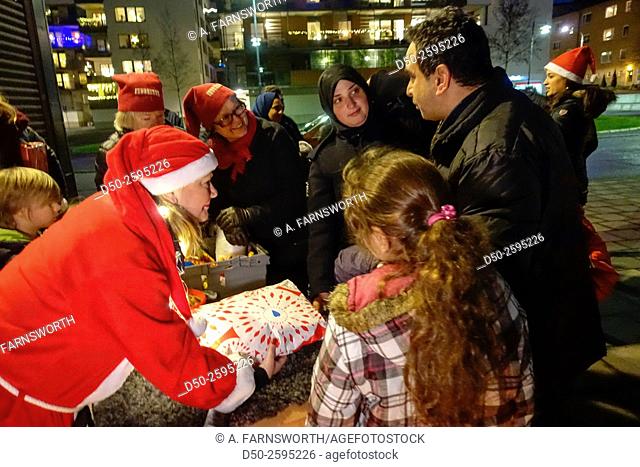 STOCKHOLM SWEDEN Local help organization Care & Share delivering Christmas presents to newsly arrived refugees