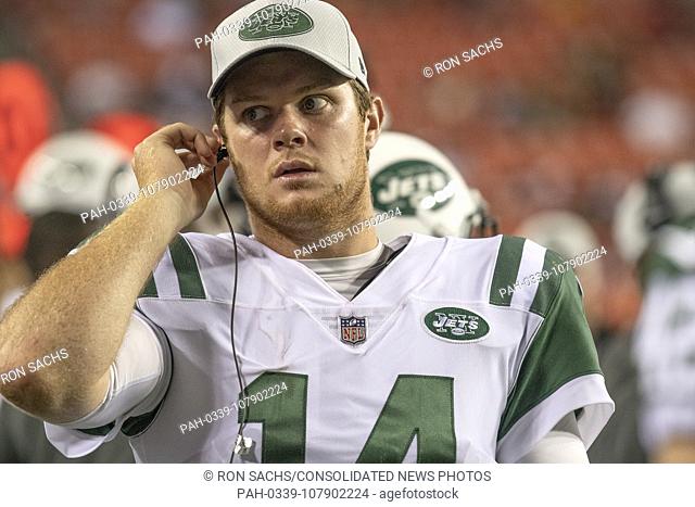 New York Jets quarterback Sam Darnold (14) follows the play-calls on the sidelines during the fourth quarter of the game against the Washington Redskins at...