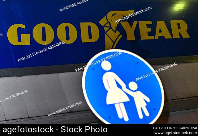 16 November 2023, Brandenburg, Fürstenwalde: The Goodyear company sign on the factory premises in the evening. The tire manufacturer Goodyear wants to shut down...