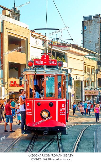 Istanbul, Turkey - July 17, 2018: Retro tram and walking people in Istiklal pedestrian street in Istanbul