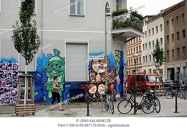 Graffiti on a building's exterior wall pictured in the corner of Eisenbahnstrasse and Wrangelstrasse in the Kreuzberg district of Berlin, Germany