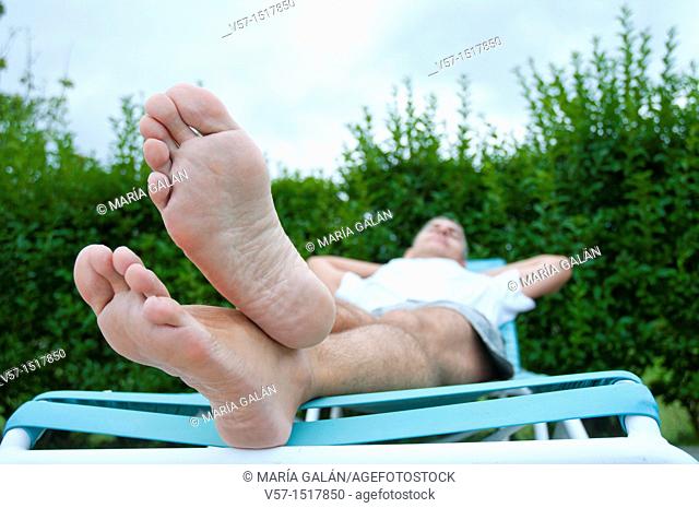 Man relaxing in a deck chair