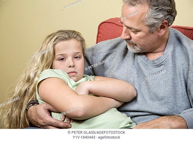 Young blonde girl and her father
