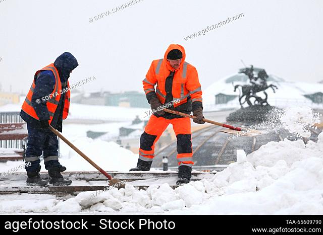 RUSSIA, MOSCOW - DECEMBER 10, 2023: Street cleaners shovel snow in Manezhnaya Square. Sofya Sandurskaya/TASS