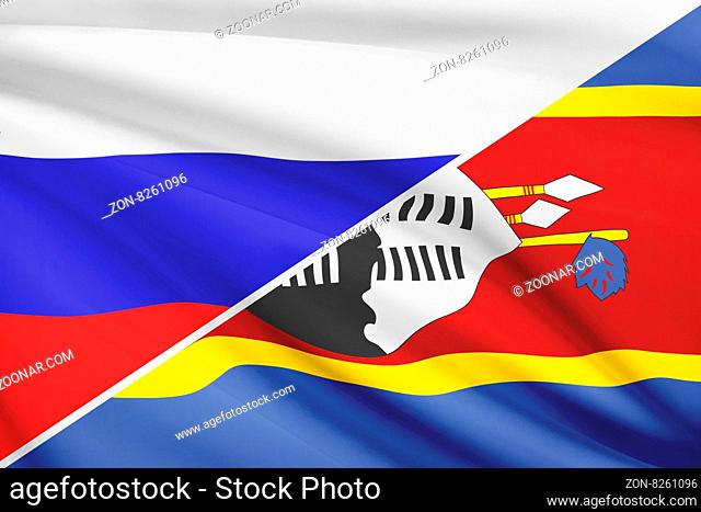 Flags of Russia and Kingdom of Swaziland blowing in the wind. Part of a series
